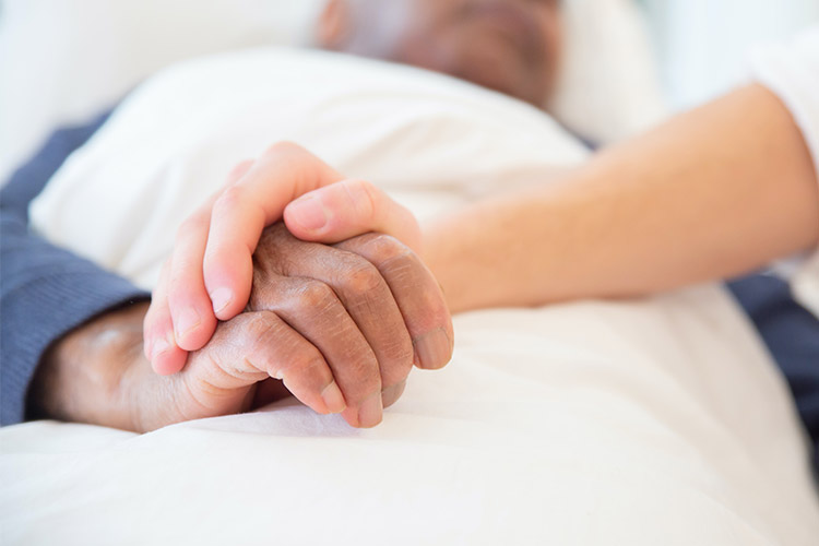 Elderly Person Having Their Hand Held